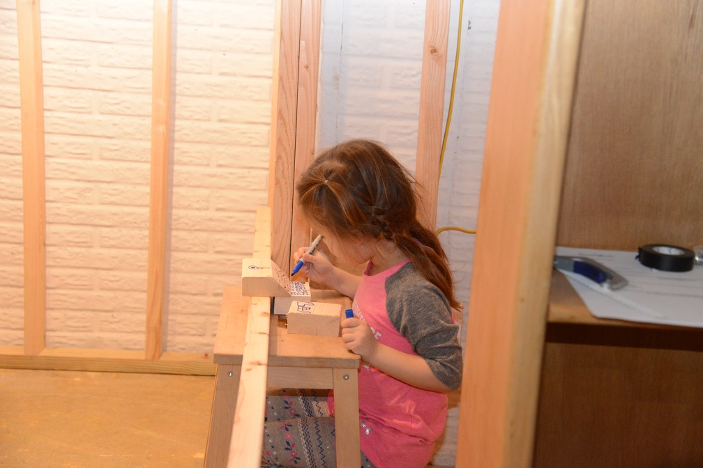 Greta Making a Computer out of wood scraps1